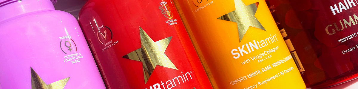 Bunte Flaschen mit Nahrungsergänzungsmitteln mit den Bezeichnungen HAIRtamin, SKINtamin und GUMMIES.