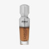 Eine halb transparente halb silberne Flasche Chroma Cover Foundation Luminous in der Farbe N8 vor weißem Hintergrund.