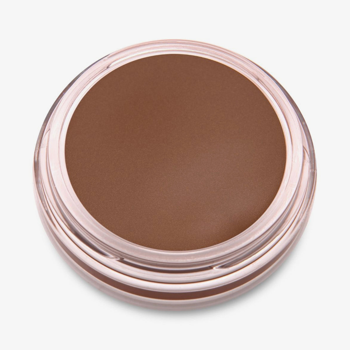 Ein runder offener Behälter mit Cronzer Cream Bronzer Acron mit braunem Inhalt auf weißem Hintergrund.