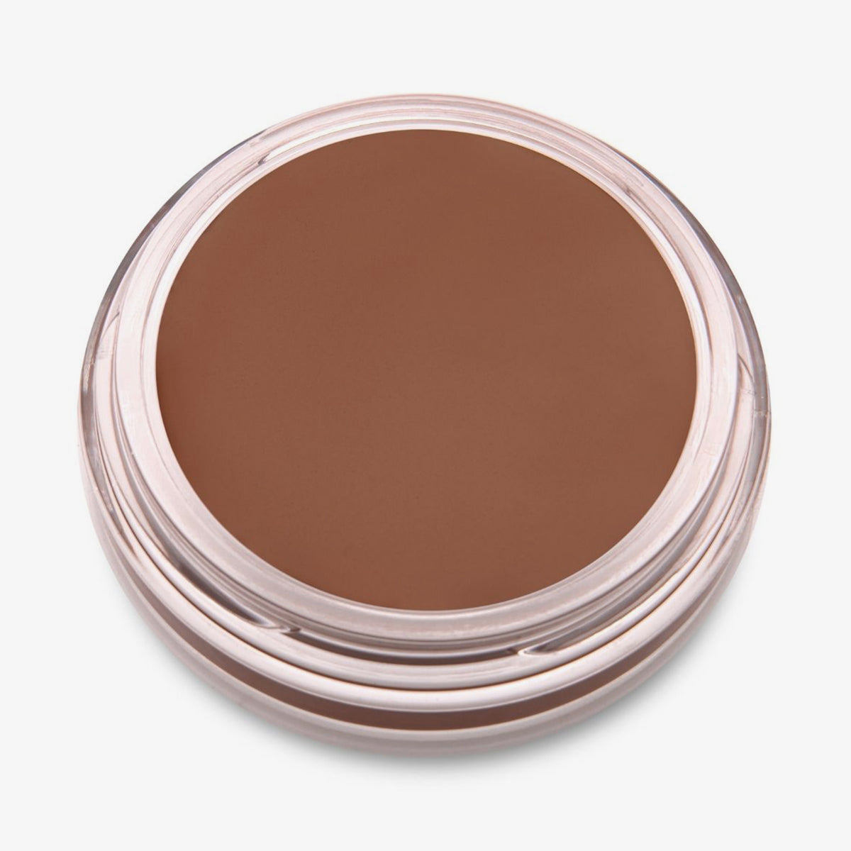 Ein runder offener Behälter mit Cronzer Cream Bronzer Swarthy mit braunem Inhalt auf weißem Hintergrund.