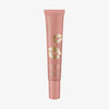 Nudefarbene Tube KISS & GLOW Peptide Lip Tint C02 mit goldenem Lippenaufdruck vor weißem Hintergrund.