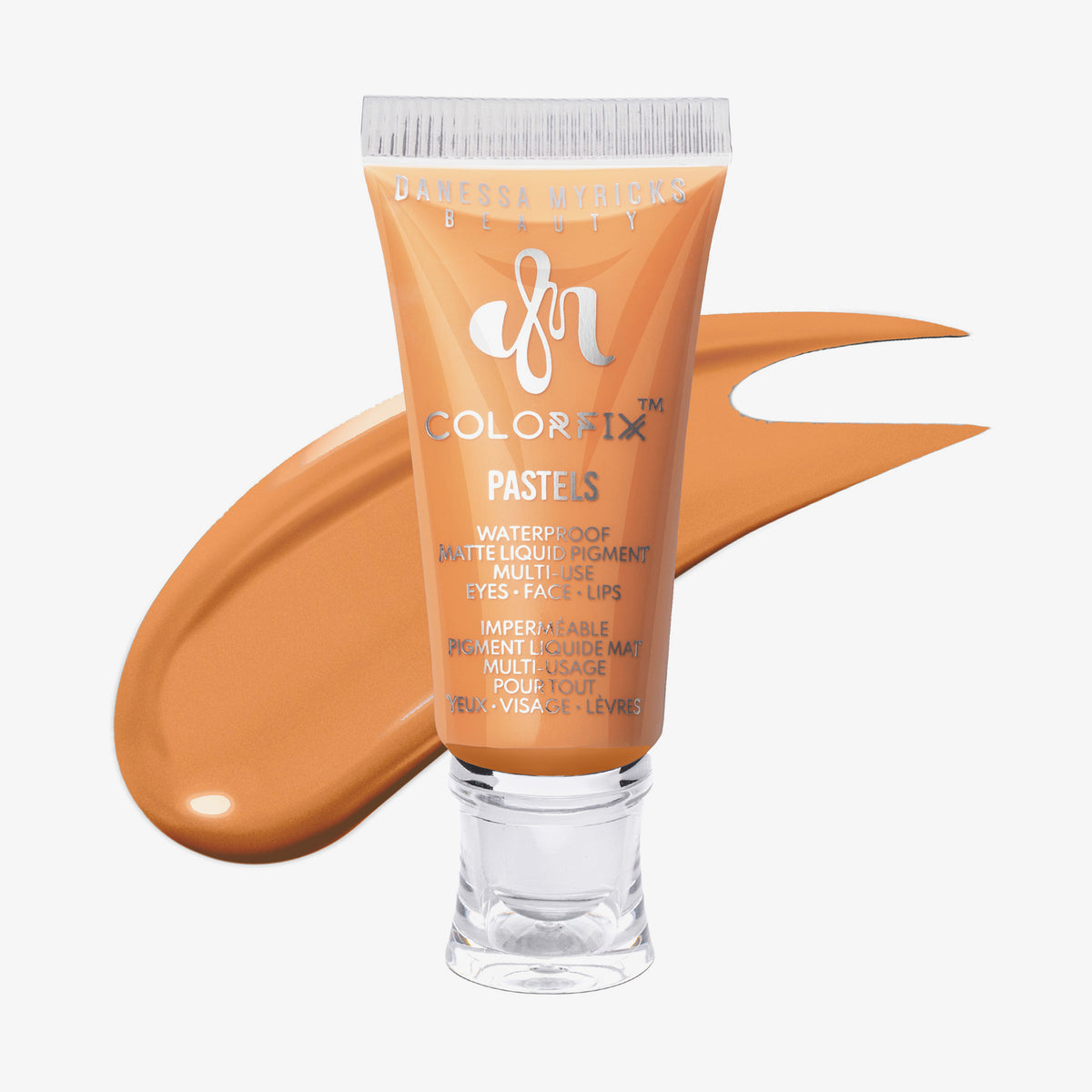 Transparente Tube Colorfix Pastels Dreamsicle mit hellorangem Inhalt und orangem Farbmuster dahinter, auf weißem Hintergrund.