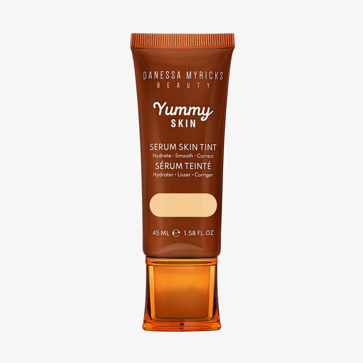 Bronzefarbene Tube der Yummy Skin Serum Tint 1 mit Sichtfenster zum beigen Produktinhalt.