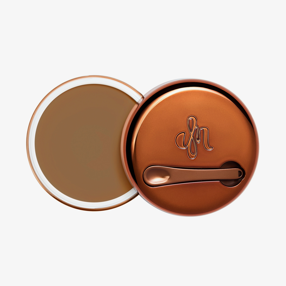 Runder geöffneter Behälter Yummy Skin Blurring Balm Shade 6 mit bronzefarbenem Deckel und kleinem Applikator.