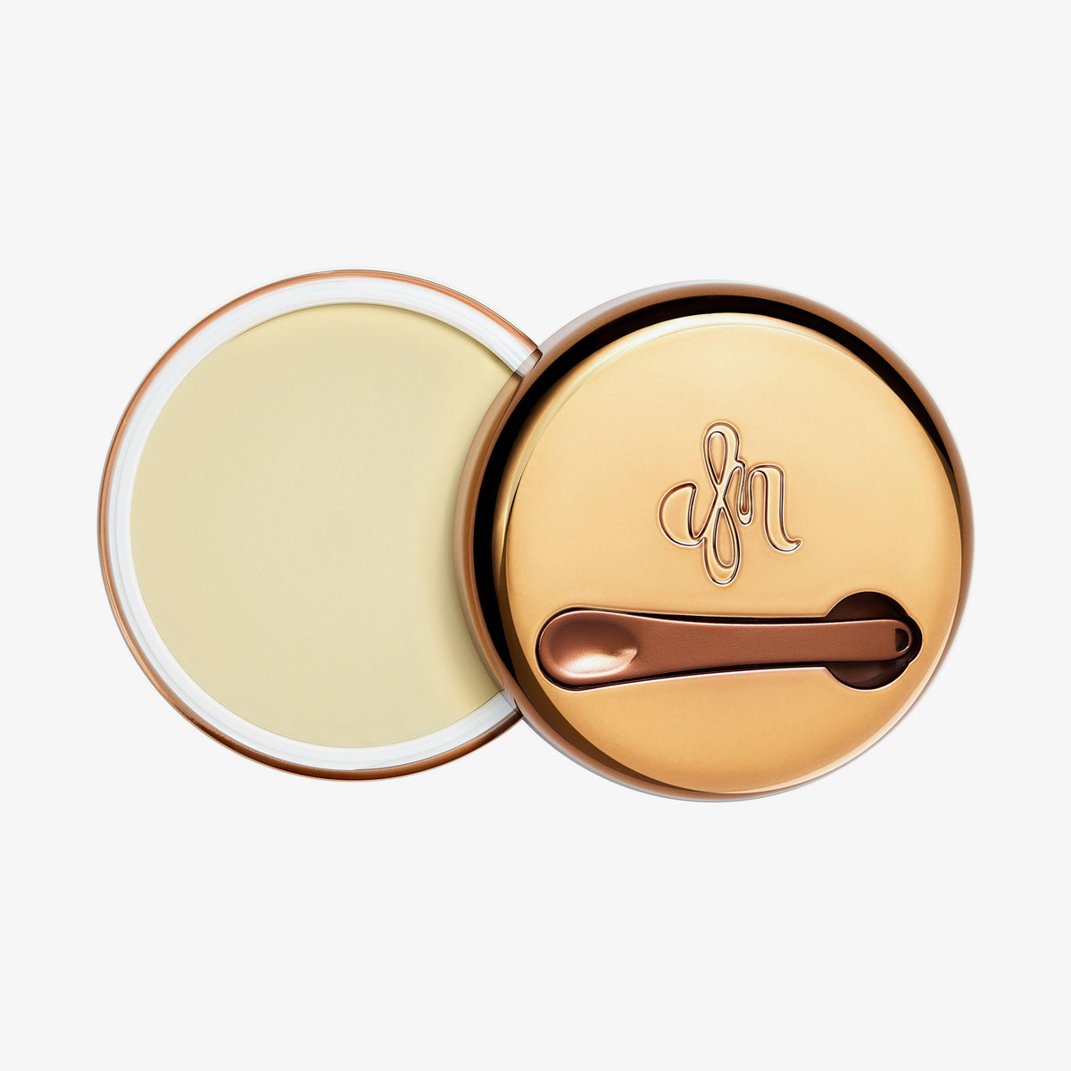 Runder geöffneter Behälter Yummy Skin Blurring Balm Shade Universal Radiant mit bronzefarbenem Deckel und kleinem Applikator.