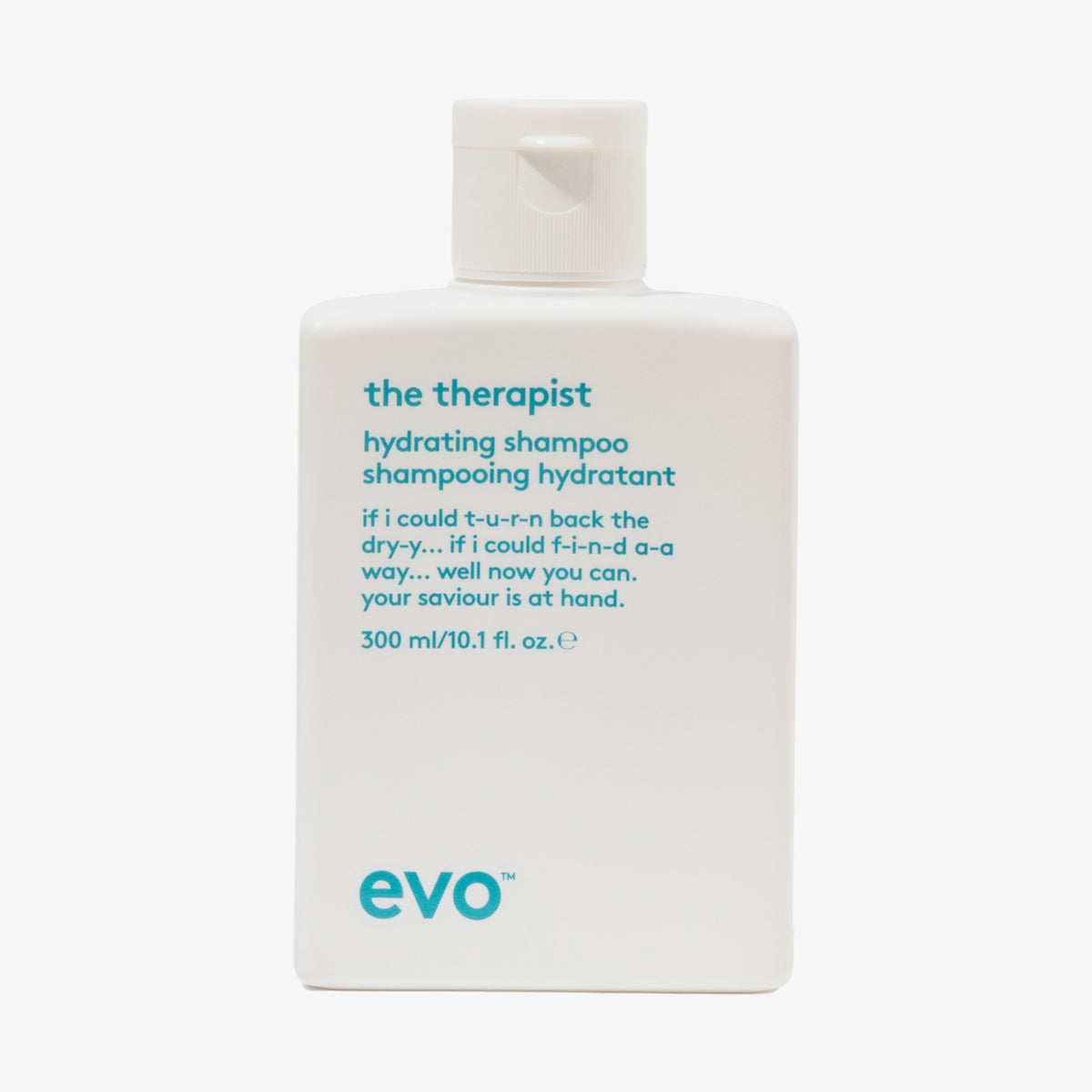 Weiße Flasche The Therapist Hydrating Shampoo mit humorvollem Produkttext auf der Vorderseite.