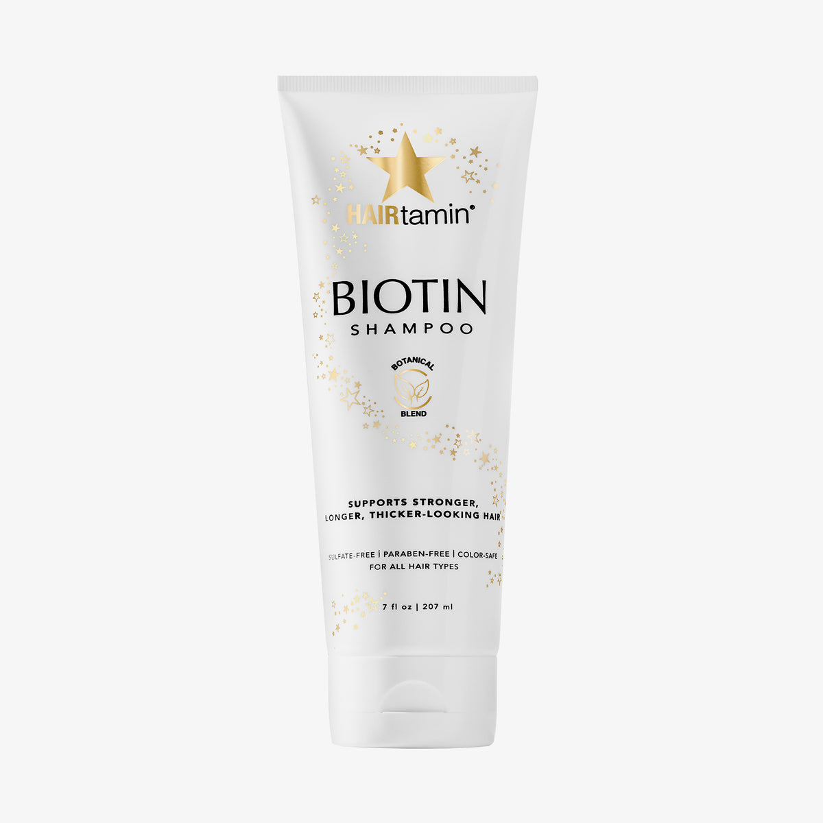 Weiße Tube Biotin Shampoo mit schwarzem Text und goldenem Stern vor weißem Hintergrund.