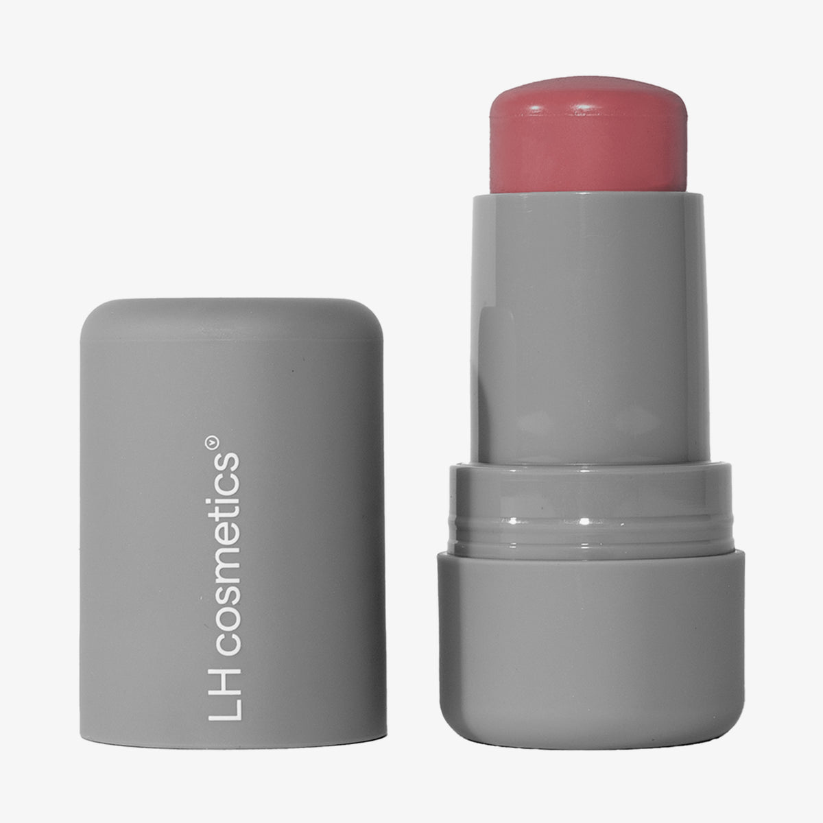 Ein geöffneter grauer Drehstift mit herausgedrehtem roséfarbenem Artistick Blush Muse vor weißem Hintergrund