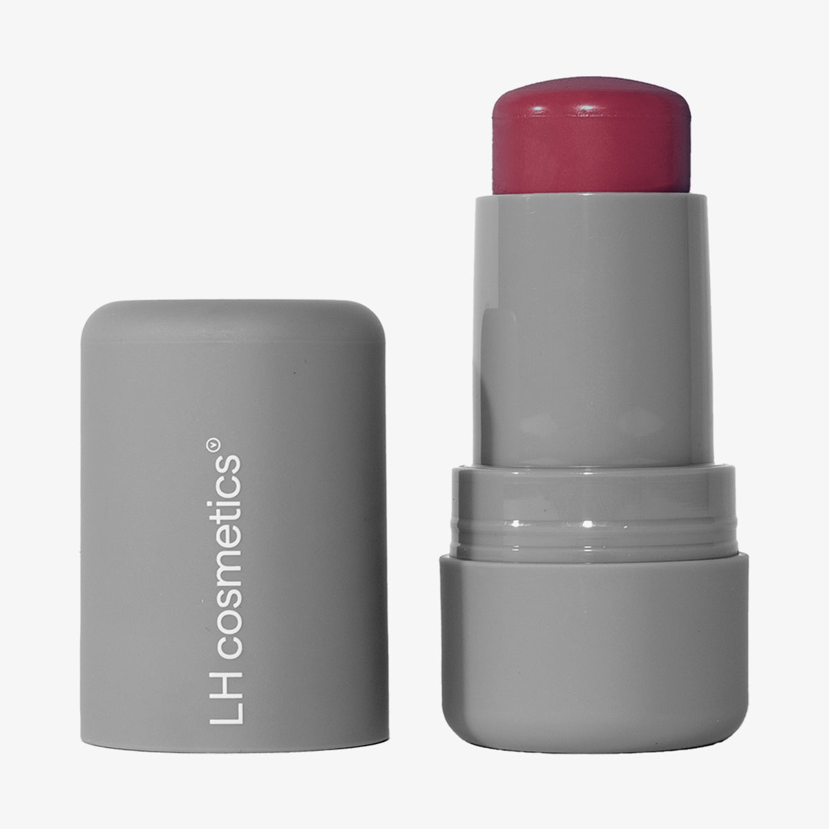 Ein geöffneter grauer Drehstift mit herausgedrehtem brombeerrotem Artistick Blush Stroke vor weißem Hintergrund.