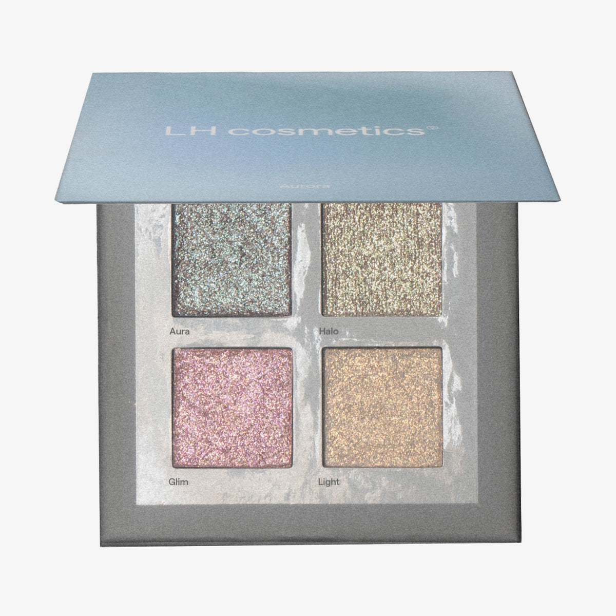 Geöffnete grau-blaue Aurora Palette von LH Cosmetics mit vier schimmernden Lidschatten in Blau-, Gold-, Rosa- und Champagnertönen.