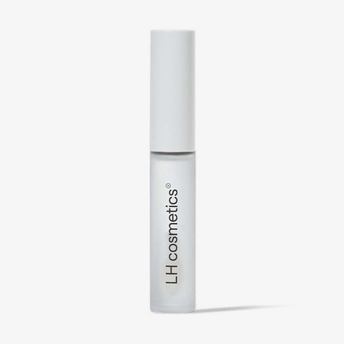 Transparente Tube LH Cosmetics Gloil mit weißem Deckel vor einem weißen Hintergrund.