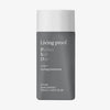 Graue kantige Flasche Living Proof Perfect Hair Day 5-in-1 Styling Treatment mit weißem Deckel.