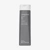 Eine graue Flasche Living Proof Perfect Hair Day Shampoo mit weißem Deckel auf weißem Hintergrund.
