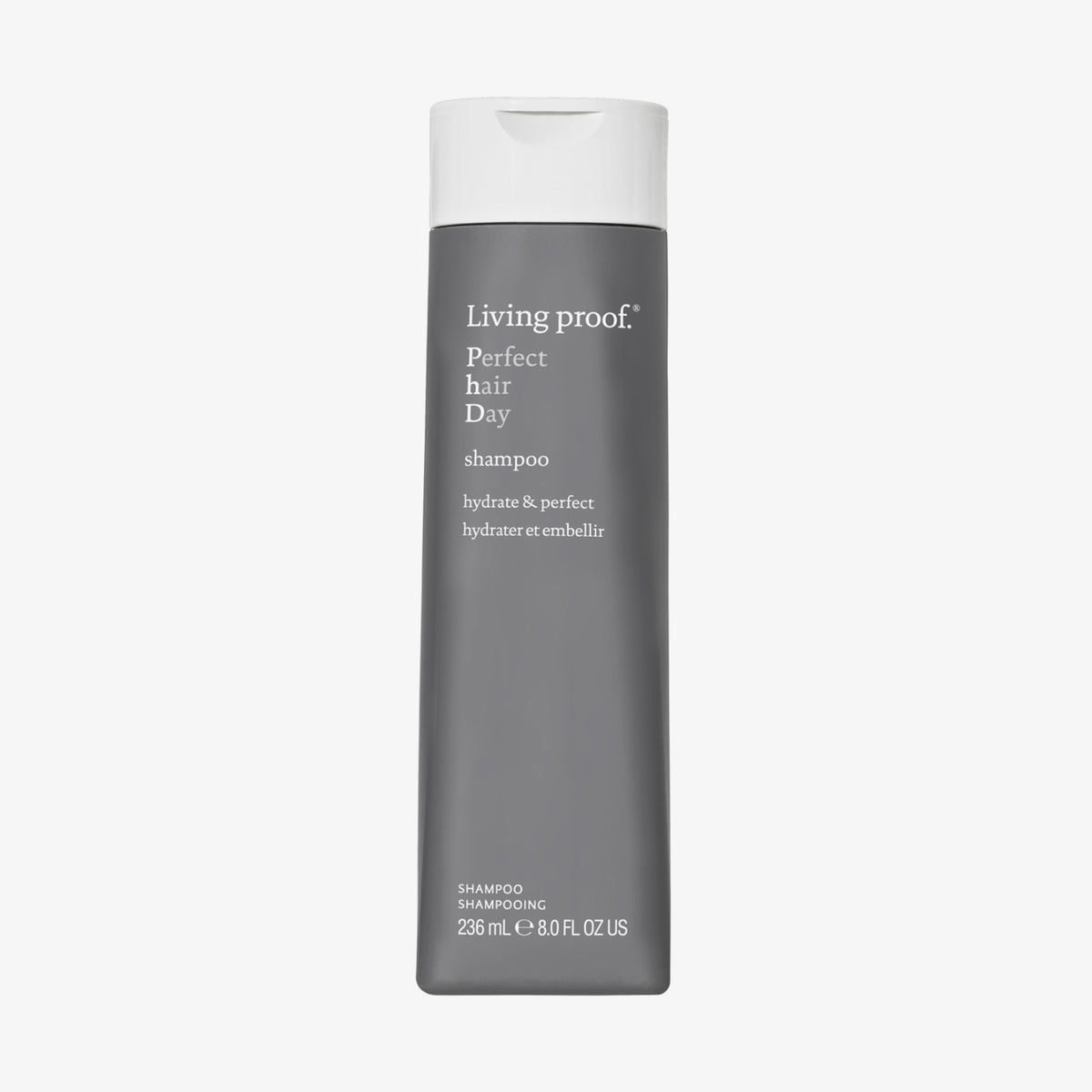 Eine graue Flasche Living Proof Perfect Hair Day Shampoo mit weißem Deckel auf weißem Hintergrund.