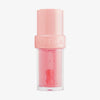 Lip Candy Oil in Litschi von NABLA in rosa-transparenter Verpackung mit rosa Deckel und glänzender, pflegender Textur.