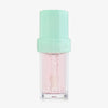 Lip Candy Oil in Watermelon von NABLA in transparenter Verpackung mit mintgrünem Deckel und glänzender leicht rosaner Textur.