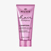 50 ml rosa Tube NUXE Hair Prodigieux Glanz-Shampoo mit Kamelienöl auf weißem Hintergrund.