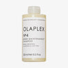 Eine 250-ml-Flasche OLAPLEX N°4 Bond Maintenance Shampoo mit schwarzem Text auf weißem Etikett.