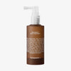 Braune Flasche mit weißer Pumpe und der Aufschrift „Hair Density Scalp Treatment“ von Transparent Lab, auf der die Liste der Inhaltsstoffe zu sehen ist.