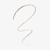 Ein geschwungenes Farbmuster des Slim’Matic Ultra Precise Brow Pencil Waterproof 025 in Braun auf weißem Untergrund.