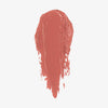 Ein roséfarbener Farbstreifen des Blush Stick – 2-in-1 Creme Rouge mit Pinsel in der Farbe Blossom.