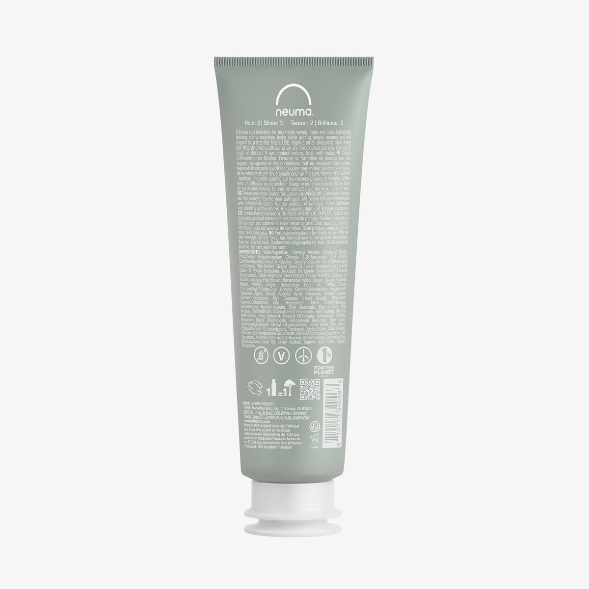 Eine grüne Tube Neuma NEU CURL™ PERFECTING CRÈME ist von hinten abgebildet, auf dem Etikett sind Text über die Inhaltsstoffe und Anwendung und Symbole zu sehen.