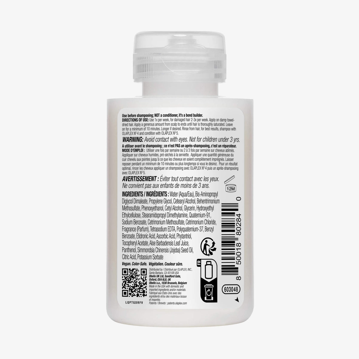 Rückseite einer durchsichtigen Plastikflasche Hair Perfector N°3 mit weißem Deckel, auf der die Produktbeschreibung zu sehen ist.