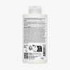Rückseite einer weißen Flasche N°5 Bond Maintenance Conditioner mit Angaben zu Inhaltsstoffen, Gebrauchsanweisungen und Recyclingsymbolen.