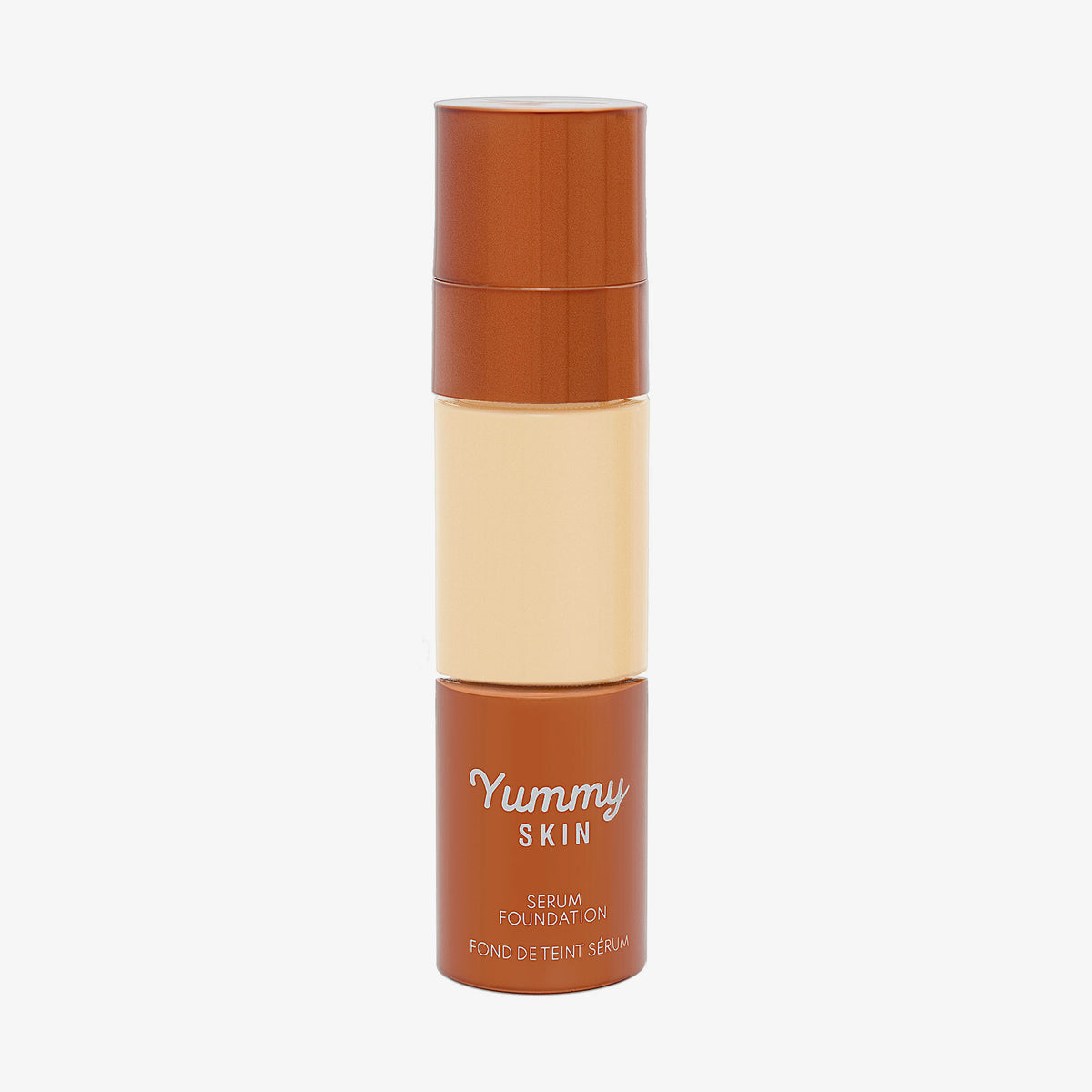 Eine halbtransparente und bronzene Flasche Yummy Skin Serum Foundation 5G mit warm-beigem Inhalt.