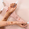 Drei Unterarme unterschiedliche Hautfarbe zeigen die unterschiedlichen Farbtöne des Melted Sun Liquid Bronzer.