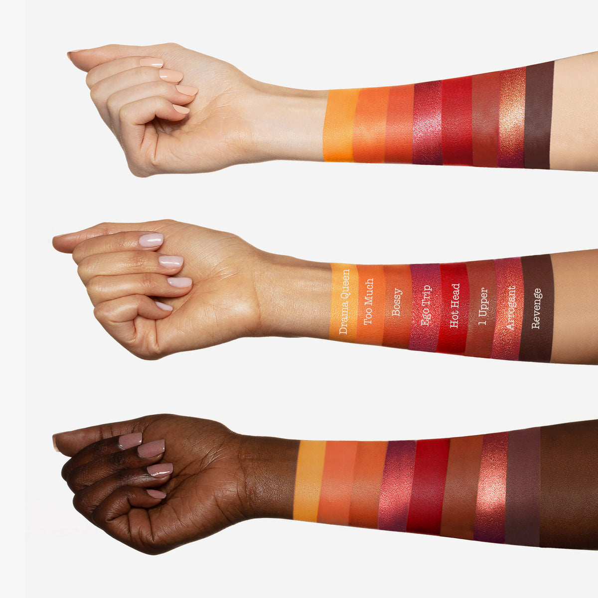 Drei Arme mit unterschiedlichen Hauttönen zeigen Farbmuster von Lidschattentönen aus der Bad Side Zodiac FIRE Eyeshadow Palette.