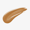 Ein warmer dunkelbeiger Farbstreifen Yummy Skin Serum Foundation 16N auf weißem Hintergrund.