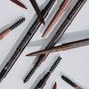 Mehrere Slim'Matic Ultra Precise Brow Pencil Waterproof auf grauer Oberfläche.