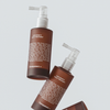 Zwei Flaschen Hair Density Scalp Treatment auf hellem Hintergrund, mit Pumpspendern.