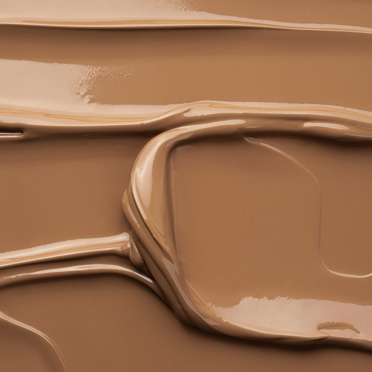 Nahaufnahme der glatten, cremig-braunen Textur der Gradual Tanning Lotion Tinted Skin Perfector
