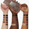 Drei Unterarme mit unterschiedlichen Hauttönen zeigen Farbmuster aus der Groundwork Palette – Defining Neutrals.