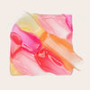 Mehrere ineinanderlaufende Swatches des Glossin‘ Glow Tinted Lip Oils von Catrice Cosmetics.