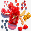 Rote Flasche HAIRtamin Gummy Stars
umringt von Granatapfel, Ingwer, Erdbeeren, Blaubeeren und Gewürzen.