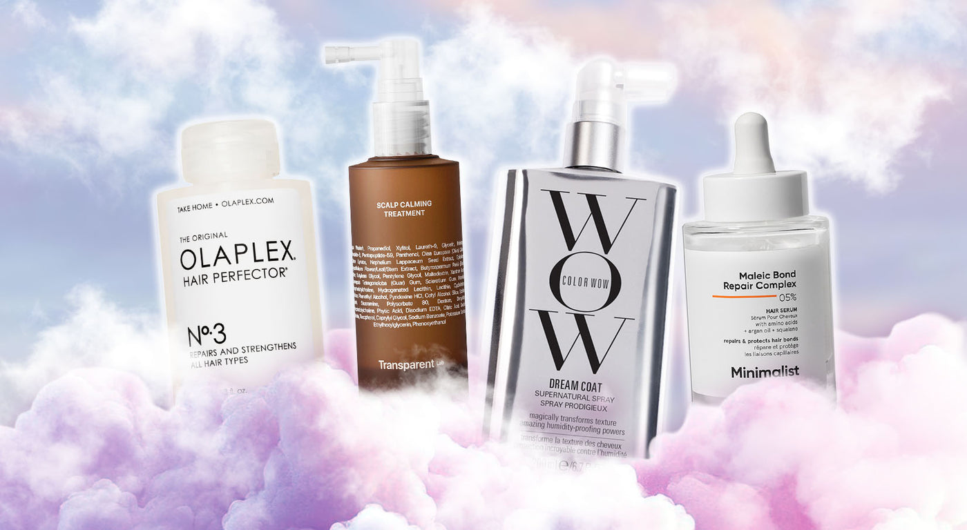 Vier Haarpflegeprodukte – Olaplex No.3, Transparent Lab Scalp Calming Treatment, Color Wow Dream Coat und Minimalist Hair Serum – schweben vor lila Wolken.