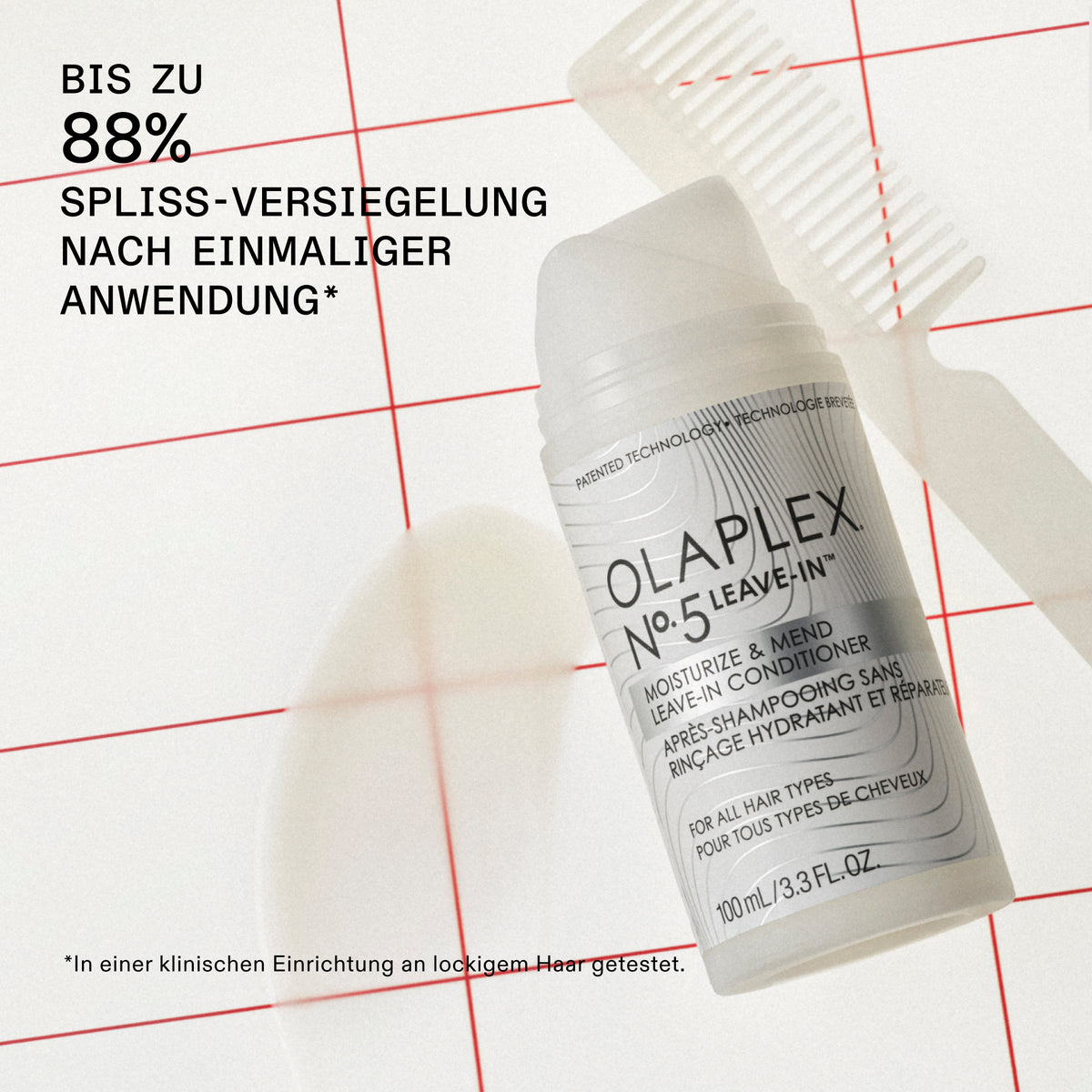 Eine Flasche OLAPLEX No°5 Moisturize & Mend Leave-in Conditioner liegt auf einer weißen Fläche mit roten Gitterlinien und weichen Schatten.