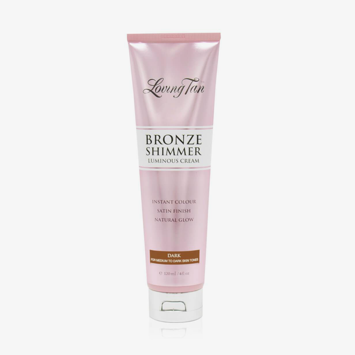 Rosa Tube der Loving Tan Bronze Shimmer Luminous Cream in der Variante „Dark“, stehend auf weißem Hintergrund, mit silberfarbenem Klappverschluss.