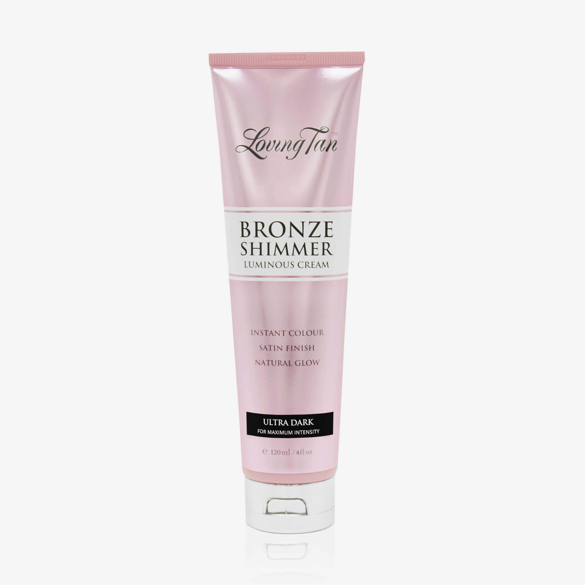 Rosa Tube der Loving Tan Bronze Shimmer Luminous Cream in der Variante „Ultra Dark“ mit silberfarbenem Klappverschluss.