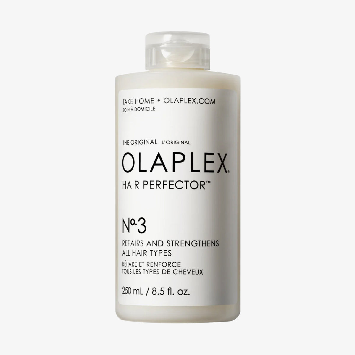 Eine durchsichtige 250-ml-Flasche N°3 Hair Perfector mit weißem Deckel und schwarzem Text auf weißem Etikett.