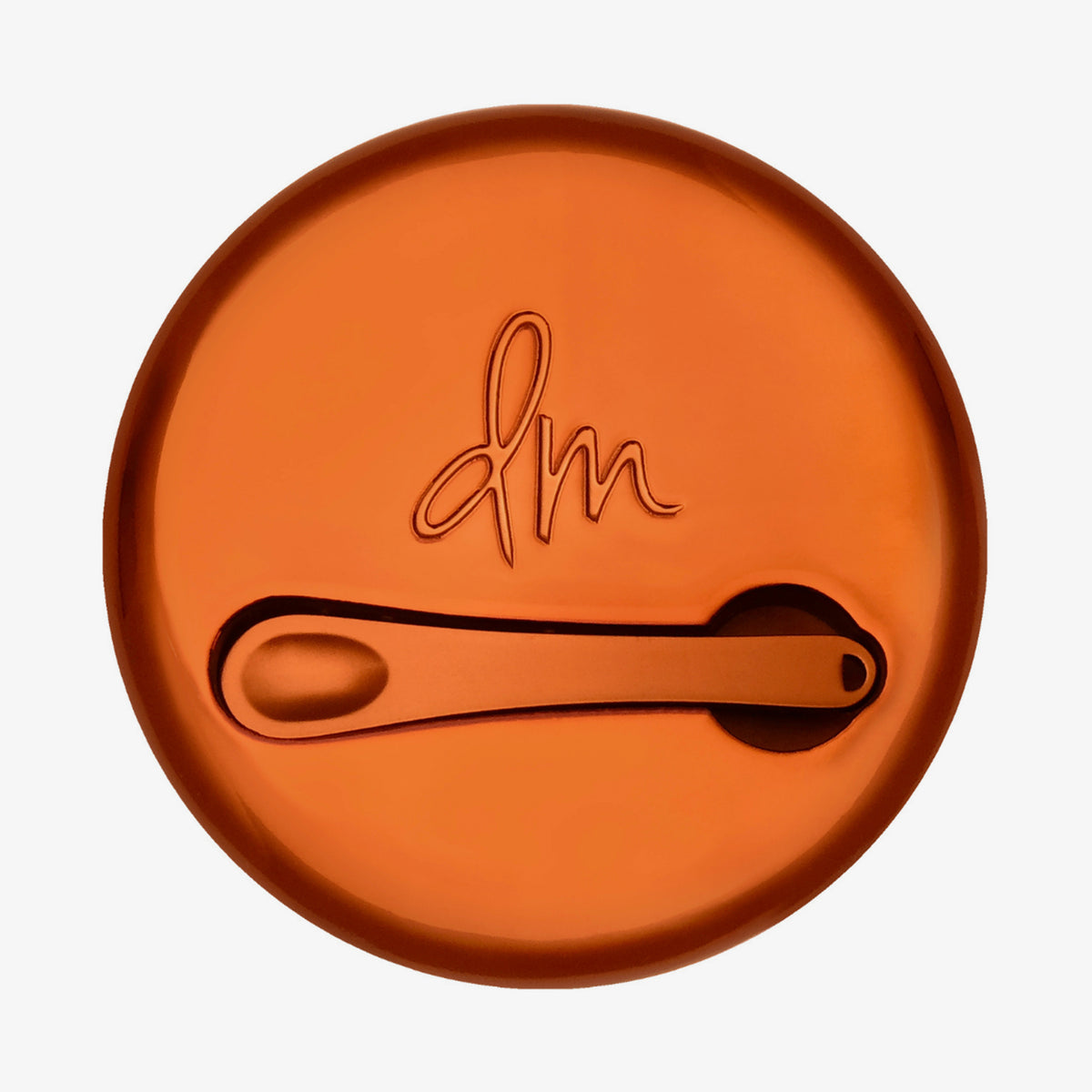 Runder geschlossener Behälter Yummy Skin Blurring Balm mit bronzefarbenem Deckel und kleinem Applikator.