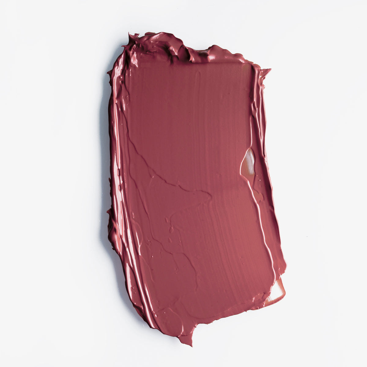 Mauvefarbener Farbstreifen des LH Cosmetics Velvet Couture Lippenstift in Deep Pink auf weißem Hintergrund.