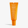Orangefarbene Tube Lip Balm LSF 50+ Tropical Mango mit Anleitung und Recyclinginformationen auf der Rückseite