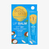 Bondi Sands Lip Balm LSF 50+ Toasted Coconut in einer blauen Verpackung mit Kokosnüssen und dem Bondi Sands Sonnenlogo