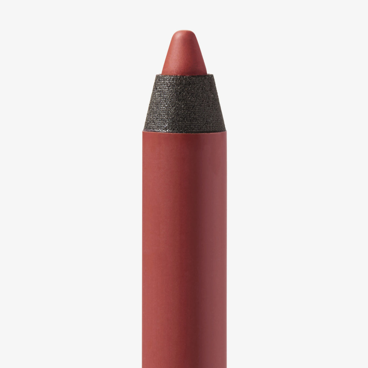 Nahaufnahme der Spitze des Close-Up Lip Shaper Lippenkonturenstifts in der Farbe Nude #4.5, ein mittleres Braun-Rosé mit neutralem Unterton, vor weißem Hintergrund.