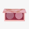 Geöffnete LH Cosmetics Duo Dimension Area Palette mit einem altrosanen und einem zartrosanen schimmernden Farbton auf weißem Hintergrund.