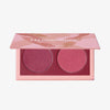 Geöffnete LH Cosmetics Duo Dimension Element Palette mit einem bordeauxrosanem und einem himbeerroten schimmernden Farbton auf weißem Hintergrund.